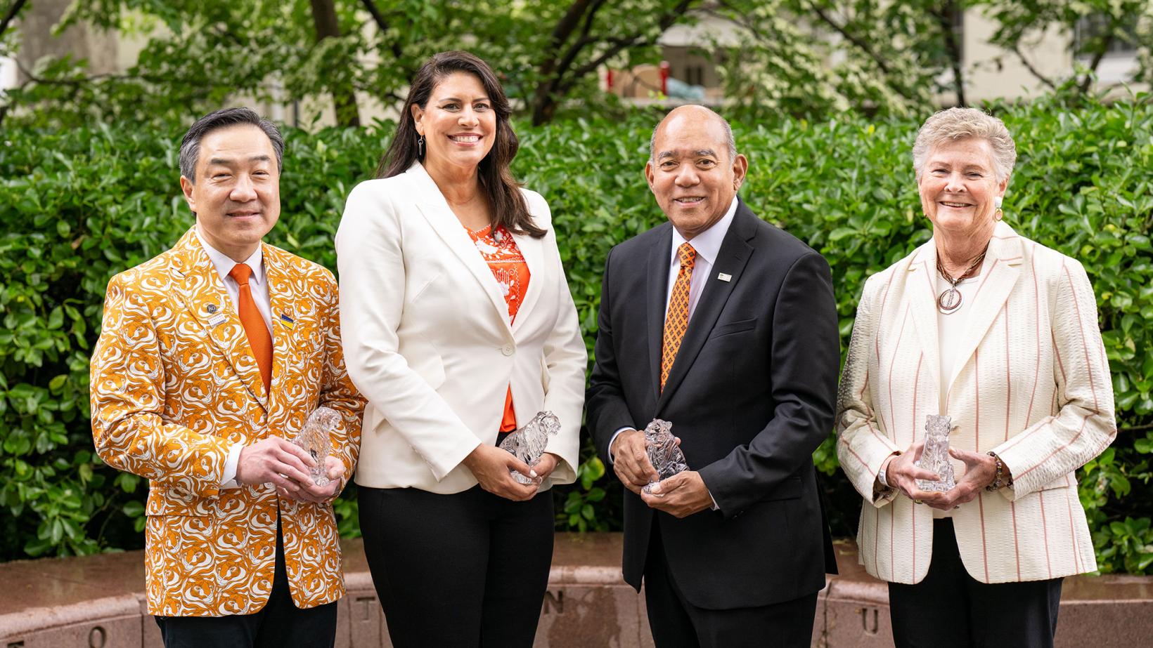 The four winners of the 2025 Award for Service to Princeton hold their crystal tigers
