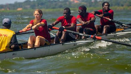 Kathleen Noble rowing with three others in a boat