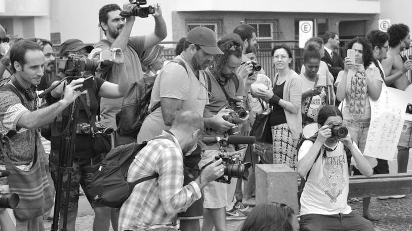 Activists filming a street demonstration