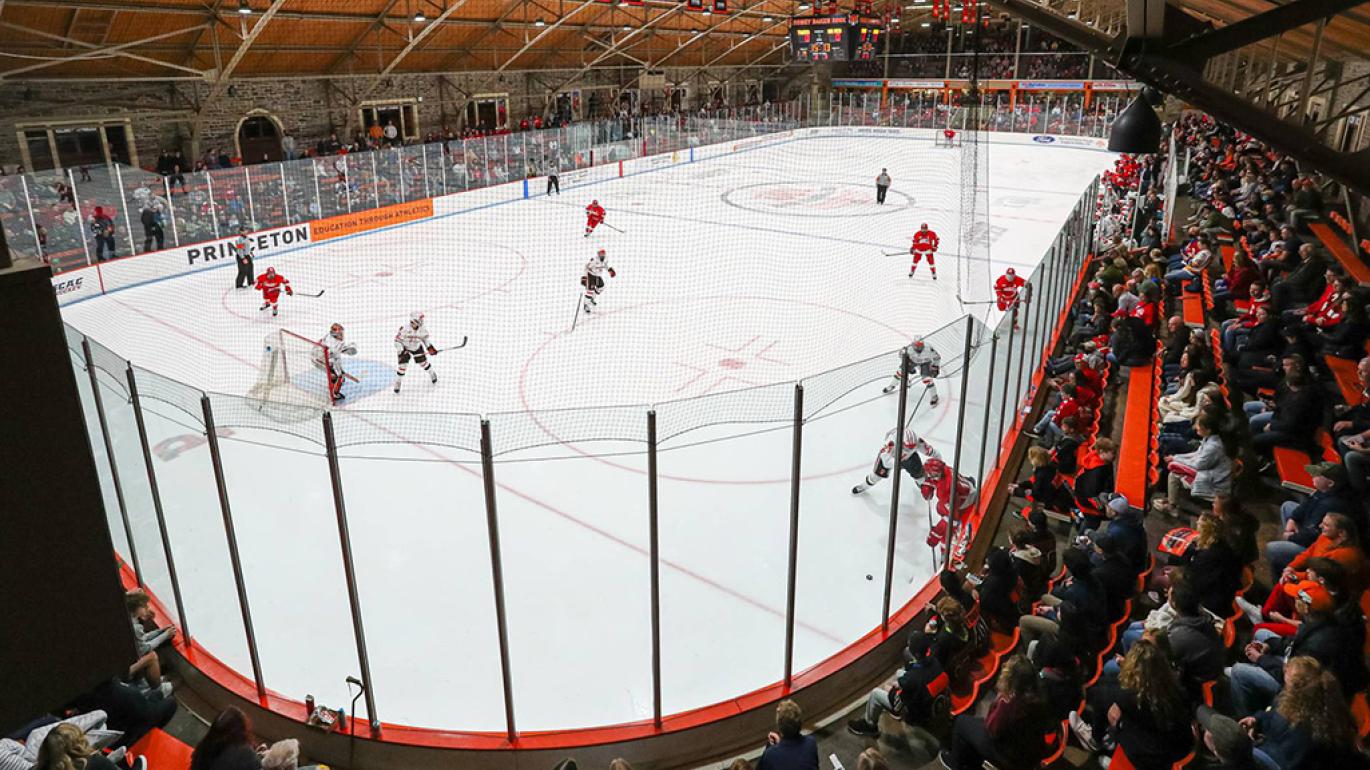 A view of hockey players skating on the ice at Hobey Baker Rink
