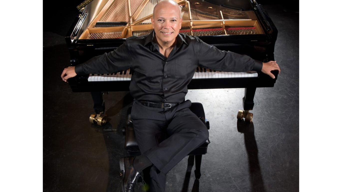 Jose Ramos Santana with a piano