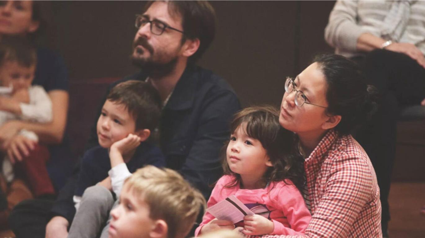 Parents sitting with children