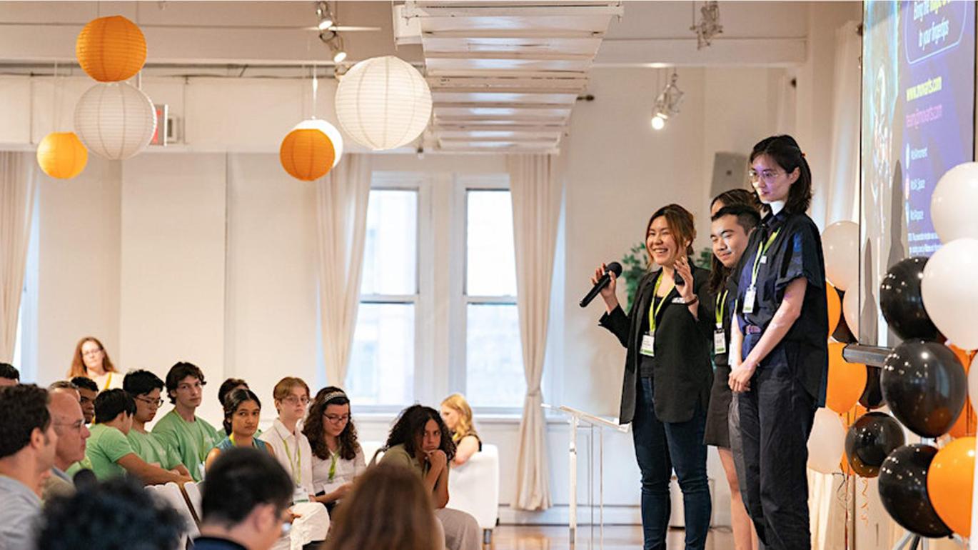 eLab Demo Day students presenting on stage