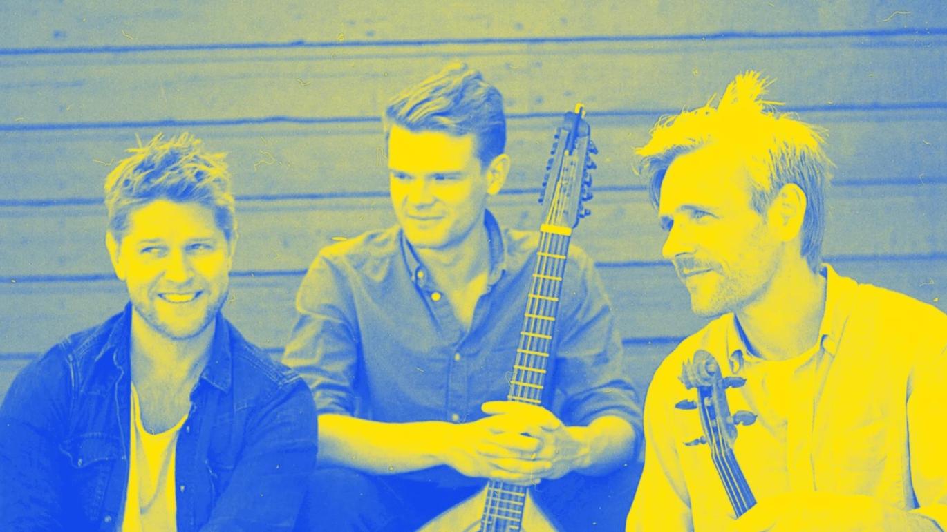 Three men holding stringed instruments