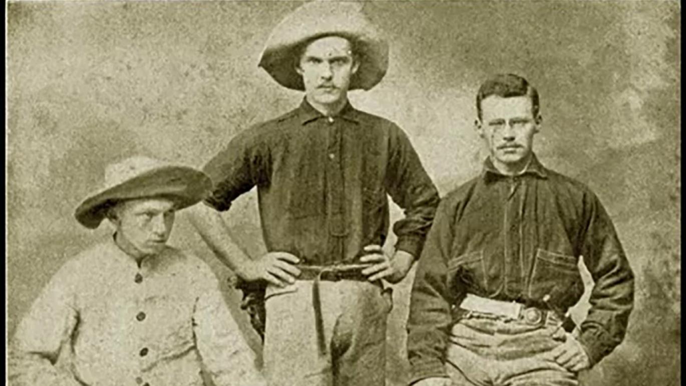 Sepia-toned portrait of three rugged looking men