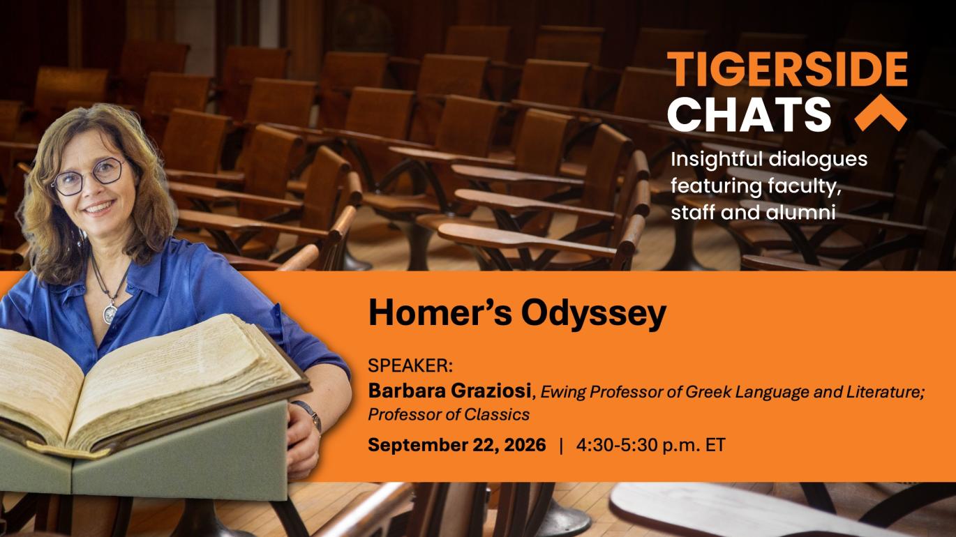 Professor Barbara Graziosi holds a book with a classroom behind her.