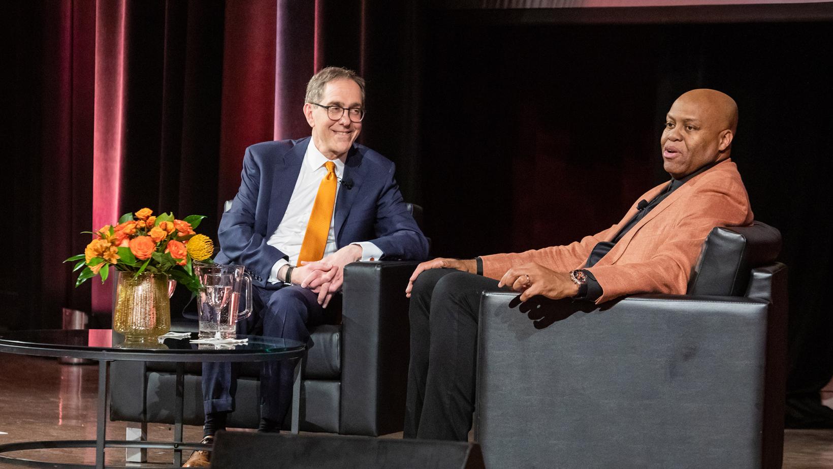 President Eisgruber smiling at Craig Robinson during a Venture Forward event in Chicago