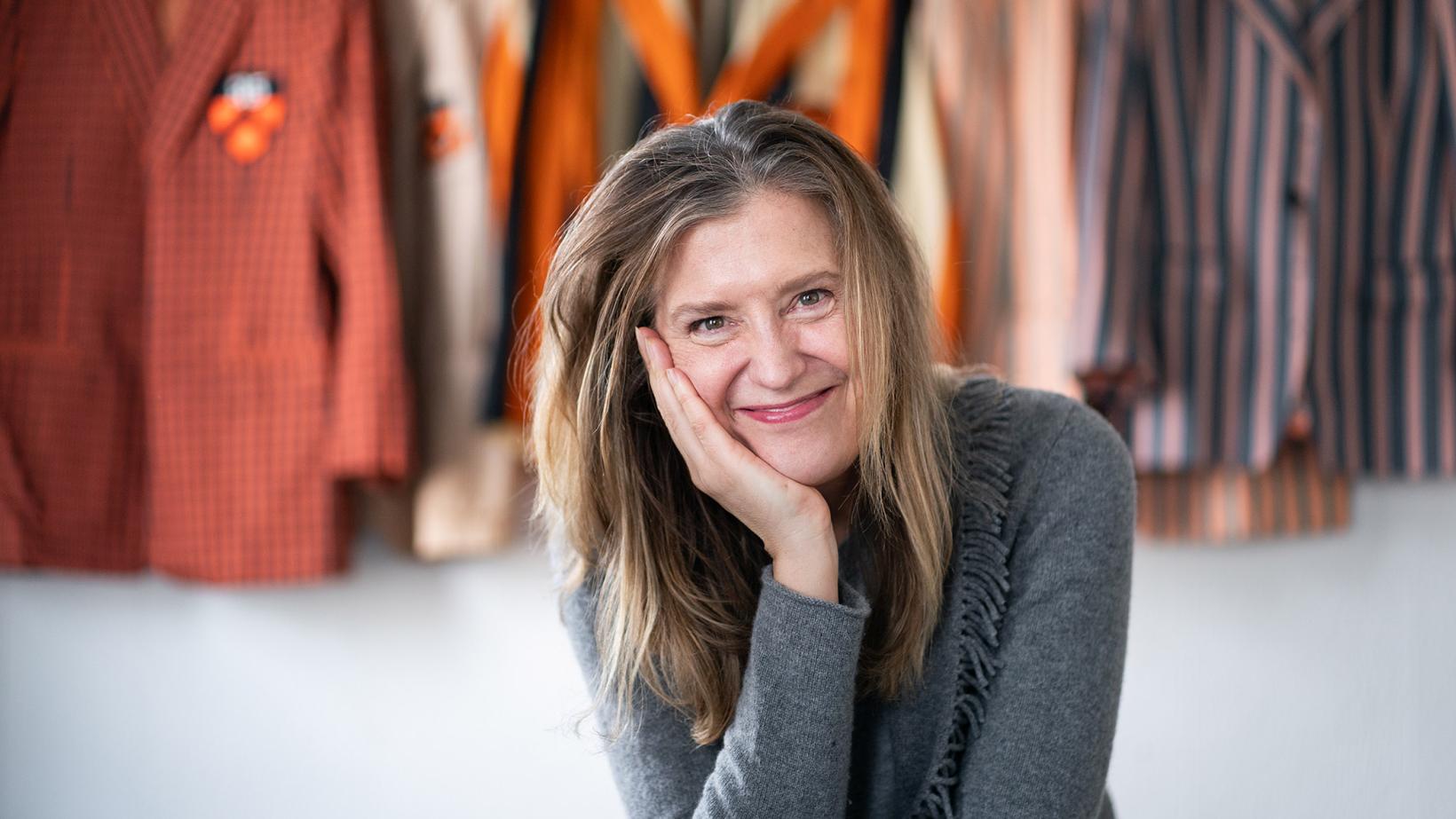 Robin Resch *03 staring directly at the camera with her hand on her cheek