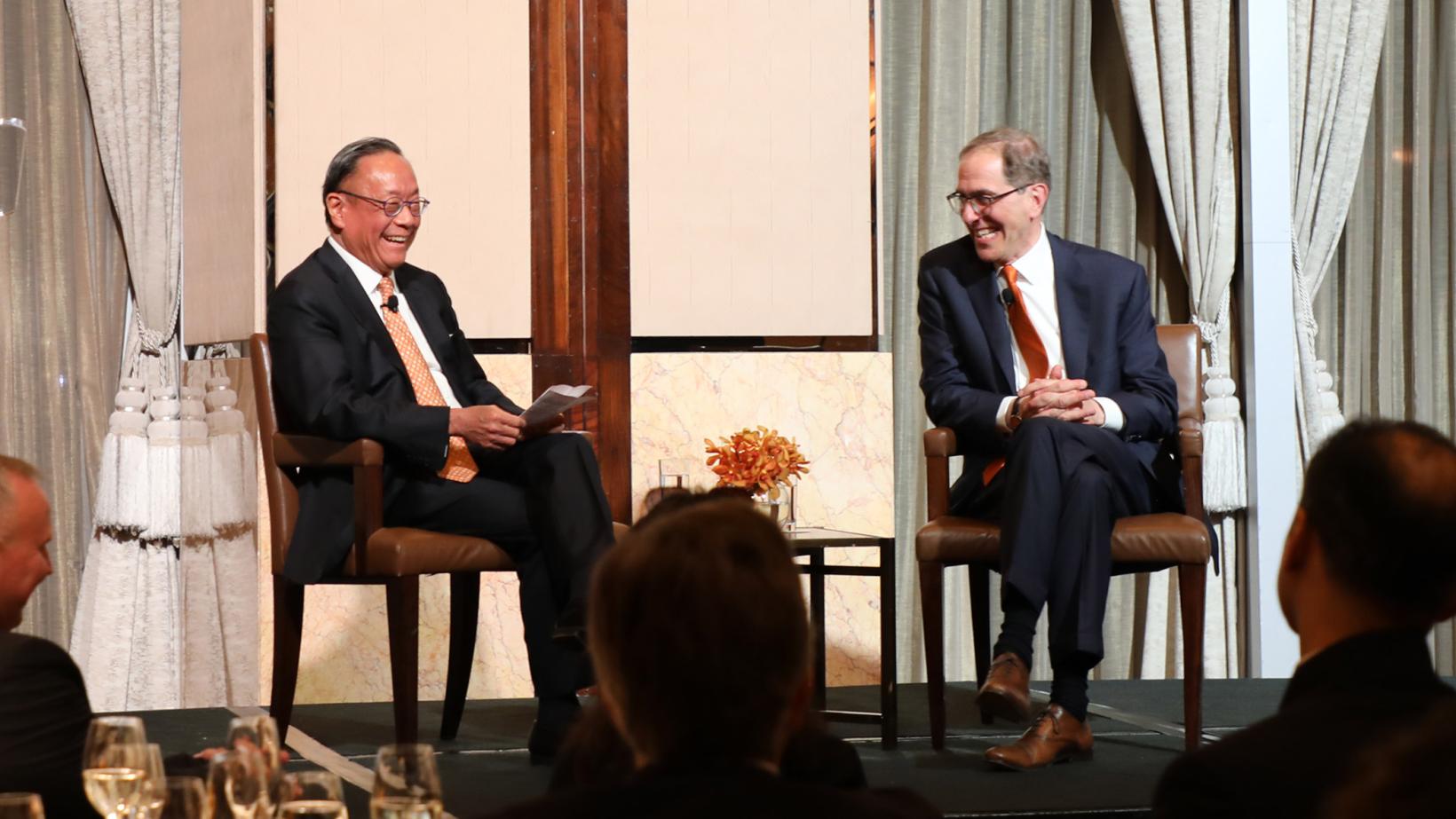 President Eisgruber and Harold Kim conversing on stage in Hong Kong