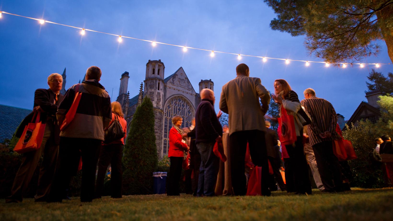 Graduate School alumni mingle near the Graduate School building during the 2013 alumni conference