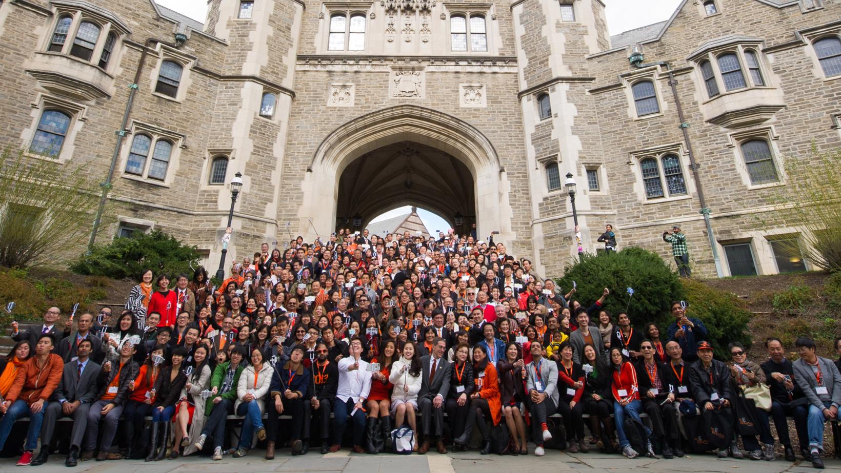 A group photo from the 2015 We Flourish conference with hundreds of Asian alumni on the steps of Blair Arch.