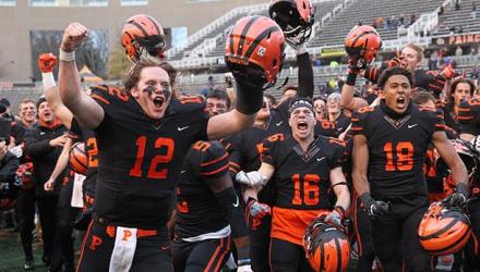 Princeton football players celebrating after win