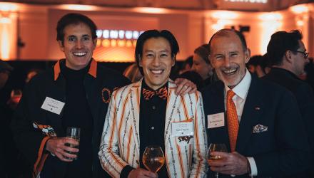 Alumni toast at the London event with President Eisgruber