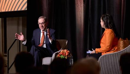 President Eisgruber gestures with his hands to make a point in his conversation on stage with Melissa Wu.