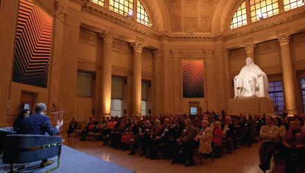 President Eisgruber sits on stage in front of an audience of Princeton alumni at the Franklin Institute in Phialdelphia. 