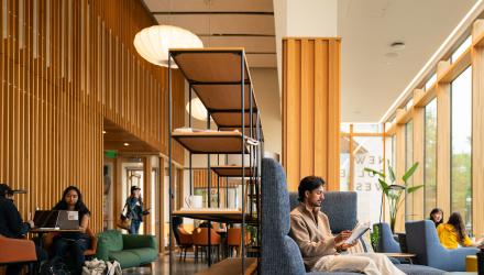Students read quietly in one of the common spaces of Huo College