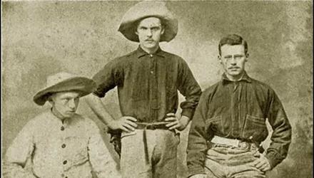 Sepia-toned portrait of three rugged looking men