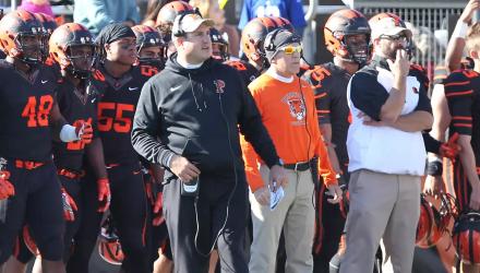 Head football coach Bob Surace and coaches and players on the Tigers sideline