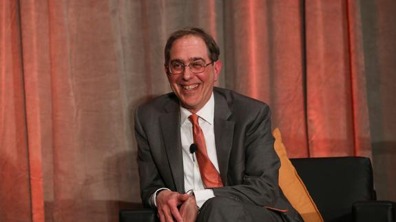 President Eisgruber, smiling on stage in San Francisco in 2022. 