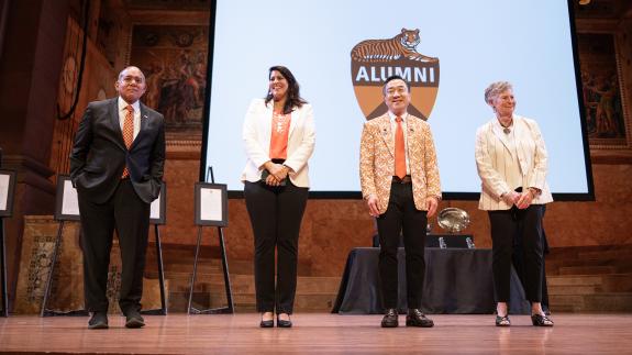 The four winners of the 2025 Award for Service to Princeton stand on stage
