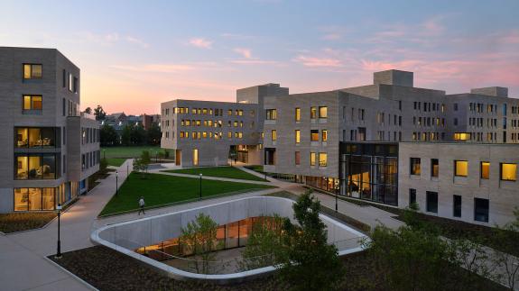 Yeh College and New College West at dusk, with green space and pathways connecting the two residential dorms.