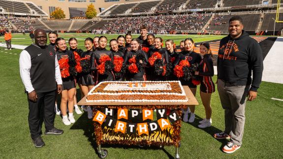 on field cake celebration at homecoming 2025