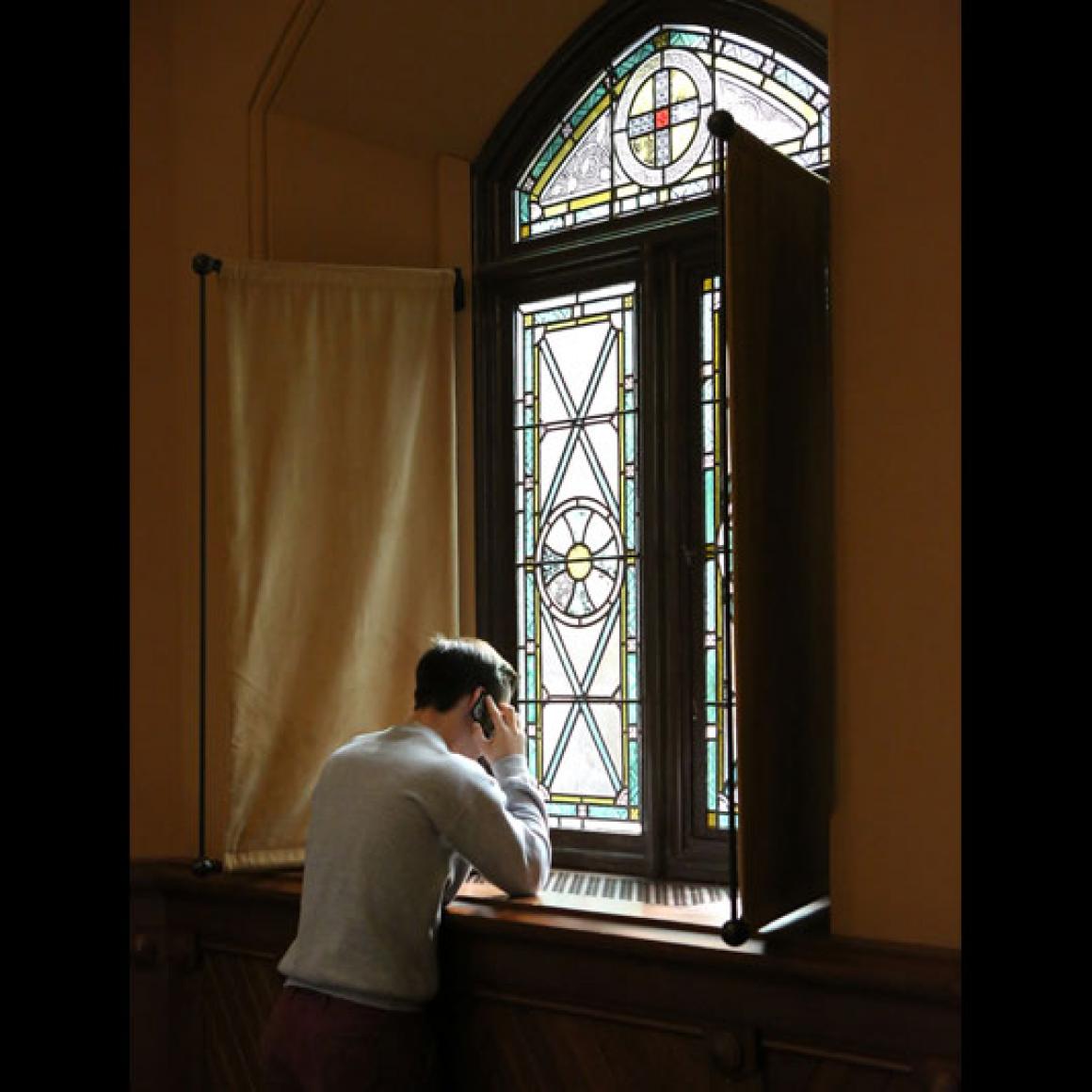 Student volunteer at window