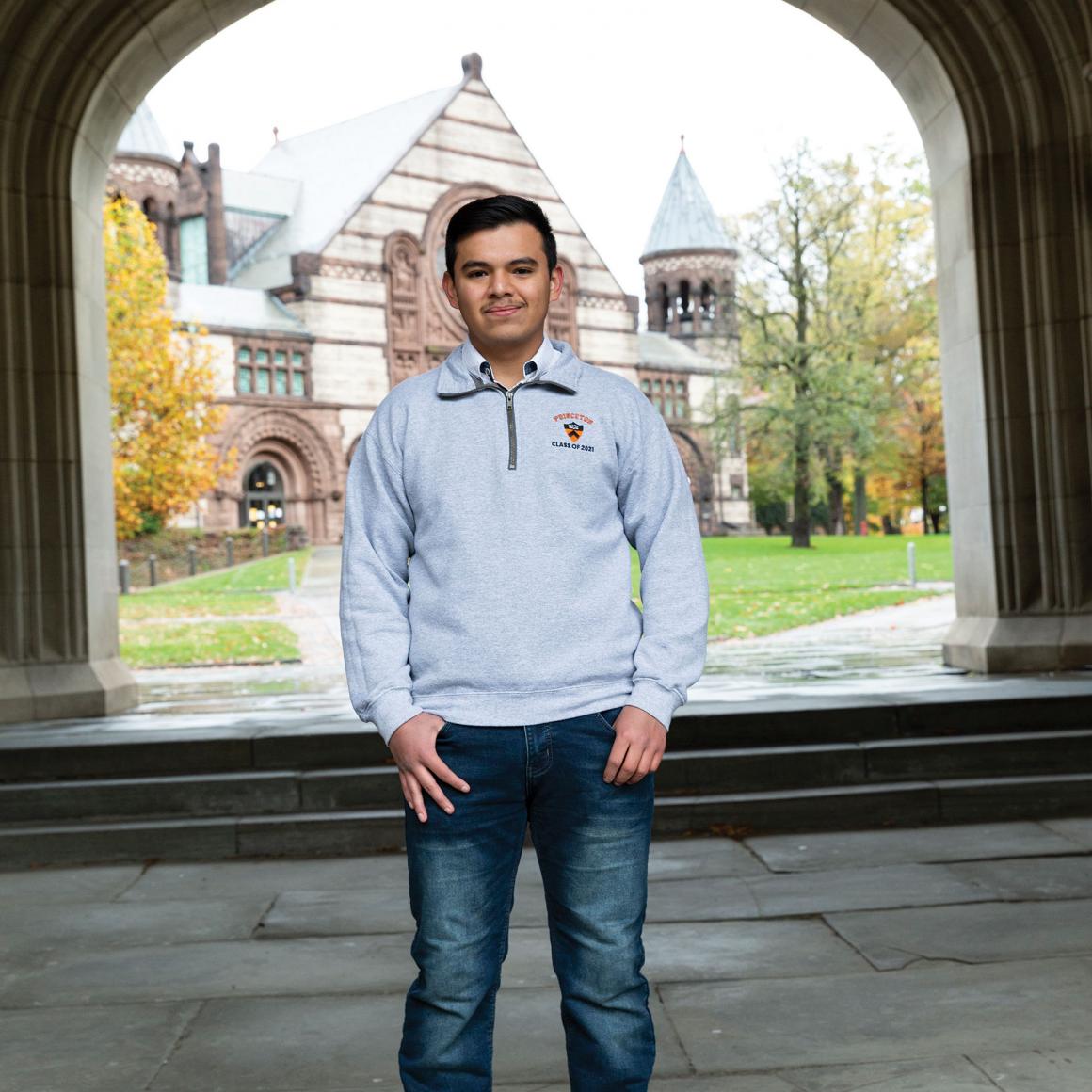 Misael Campos '21 framed by archway with Richardson Hall in background