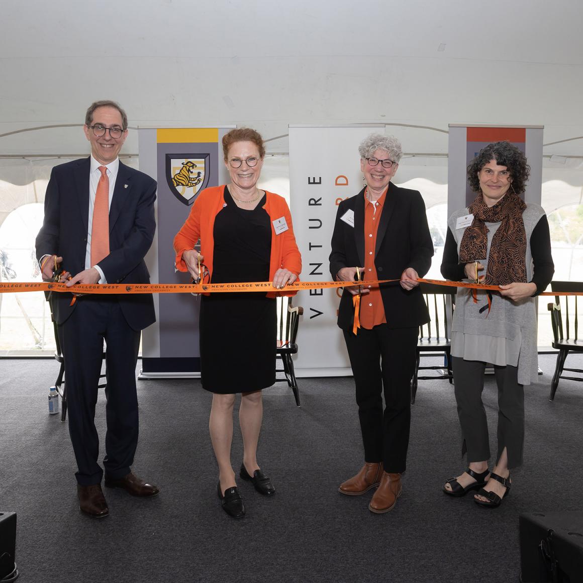 President Eisgruber leads others in the ribbon cutting ceremony of New College West