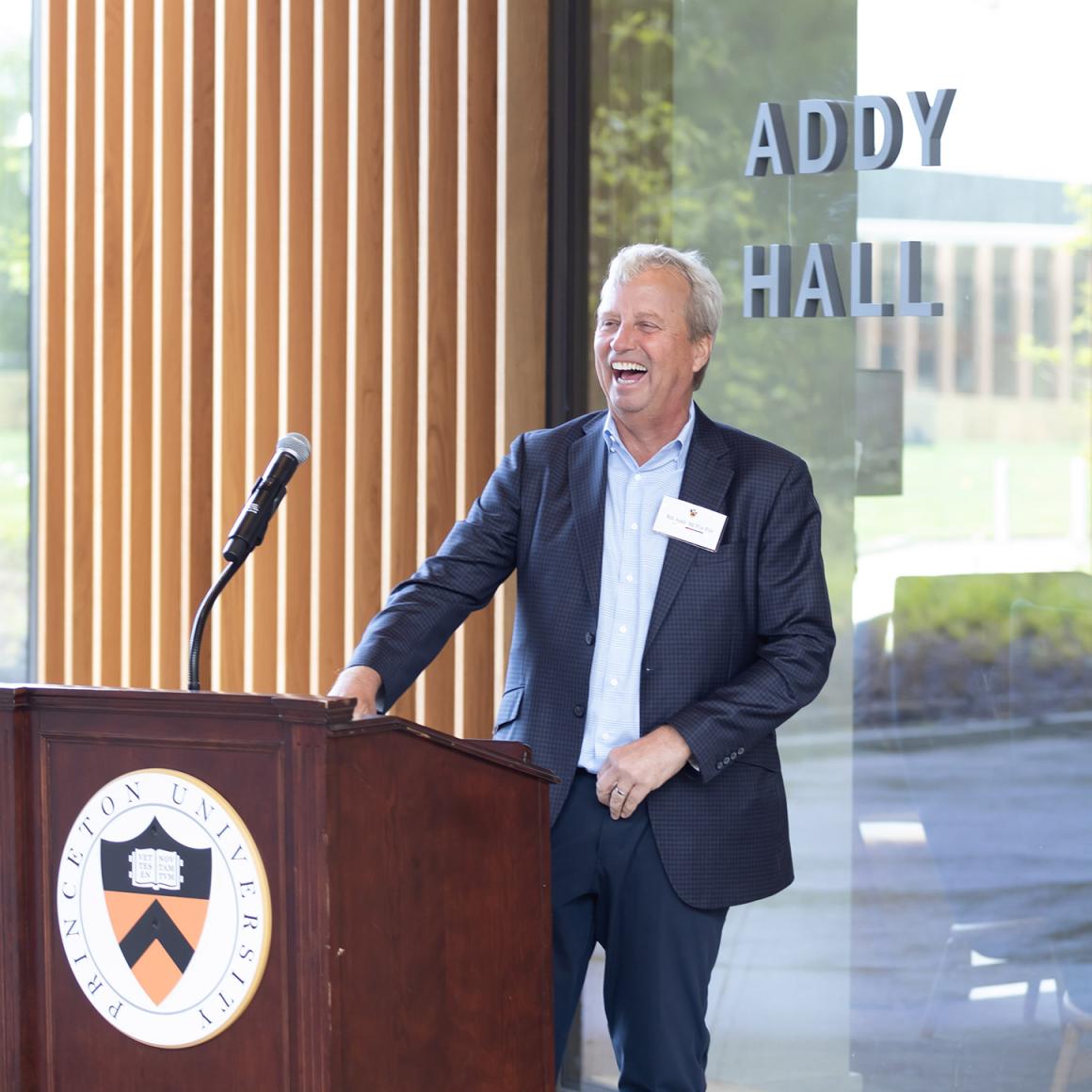 Bill Addy laughs during his speech dedicating Addy Hall