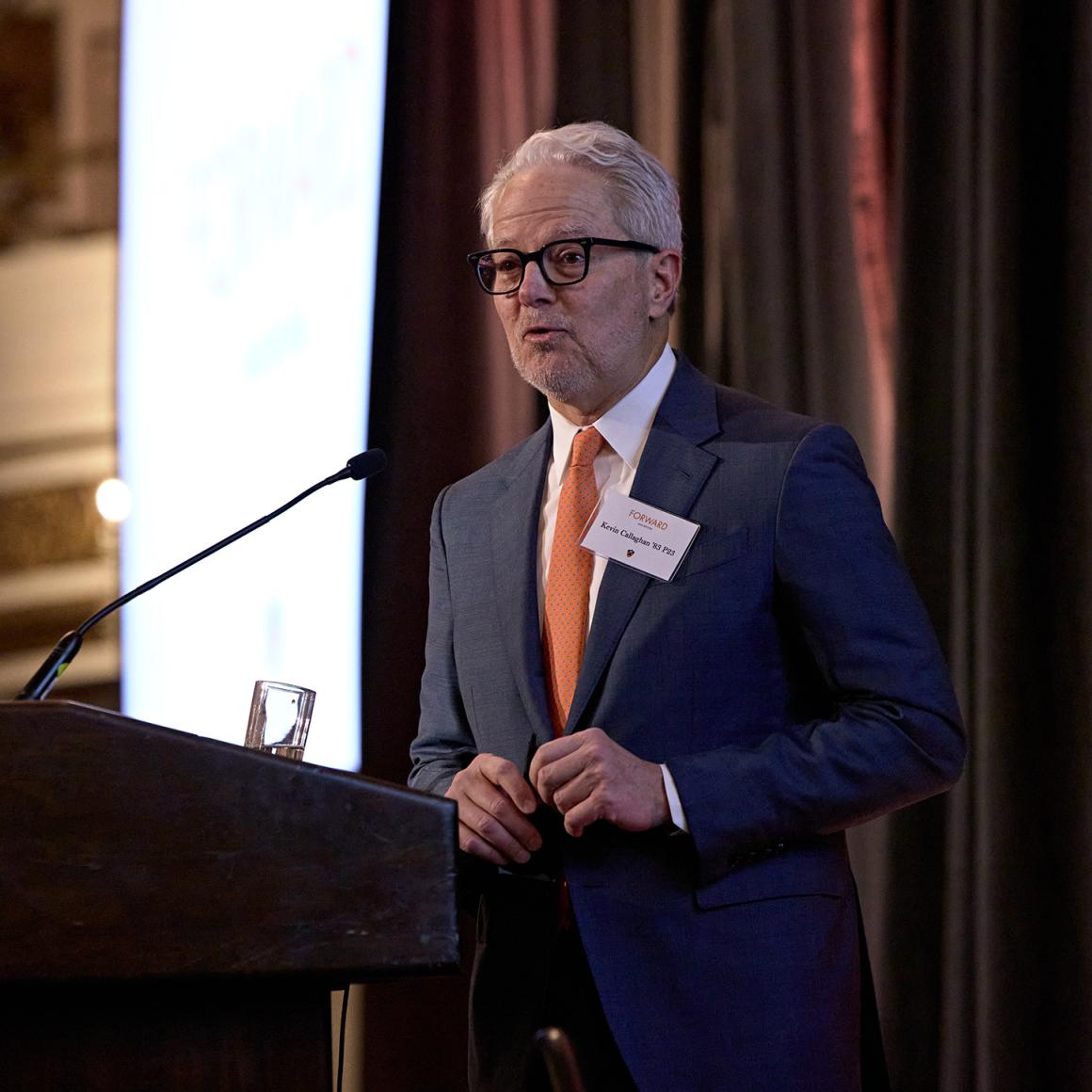 Kevin Callaghan speaks from the podium at the Boston event.