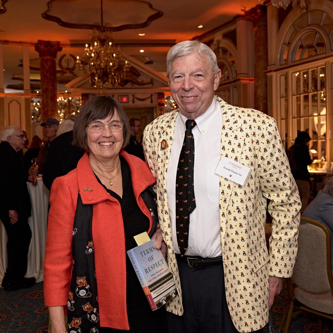 A Princeton couple dressed in orange.