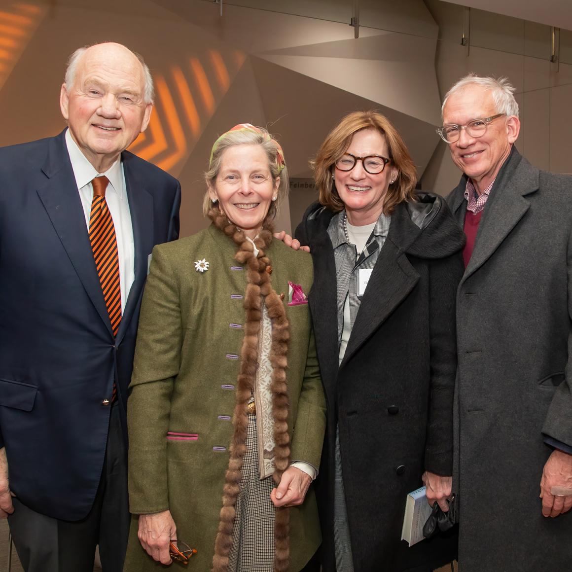 Two smiling couples.