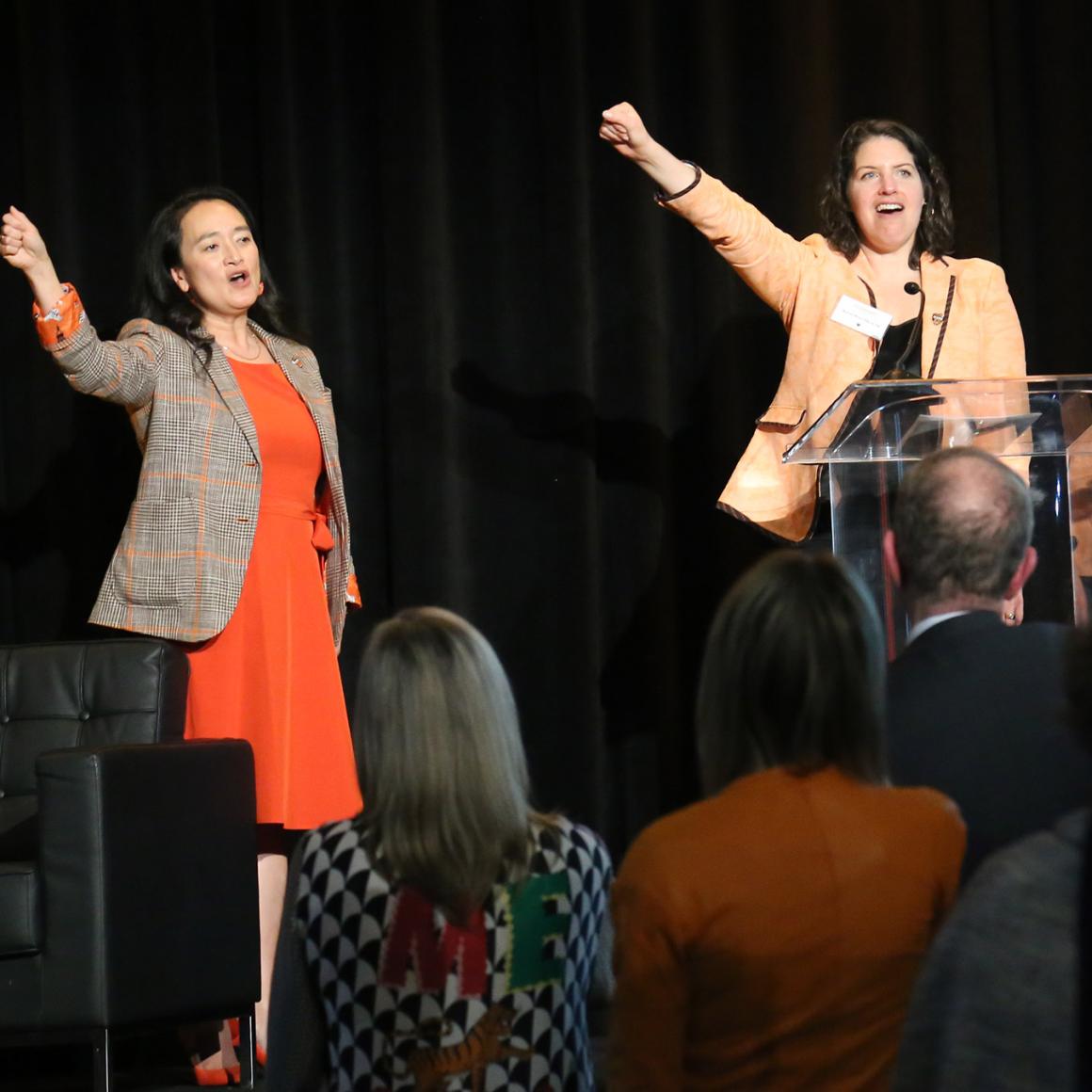 April Chou and Karen Roter Davis ’94 lead the singing of "Old Nassau"