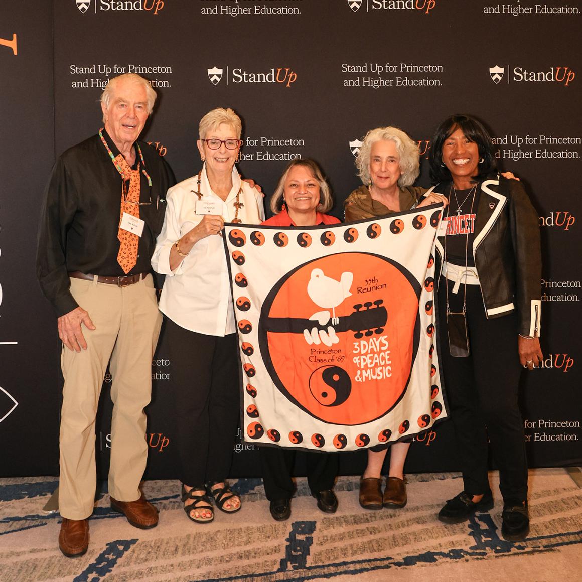 Alumni holding a Class of 1969 banner