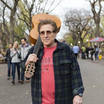 Joel Rosenman '63 with guitar