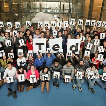 Chemistry grad students holding up Thank You signs