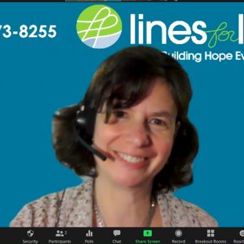Elissa Adair '88 wearing a headset ready for a virtual call
