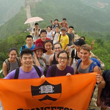 Students holding Princeton flag at the Great Wall