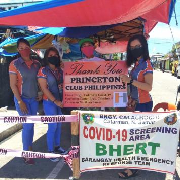 Four women hold sign thanking Princeton Club of Philippines