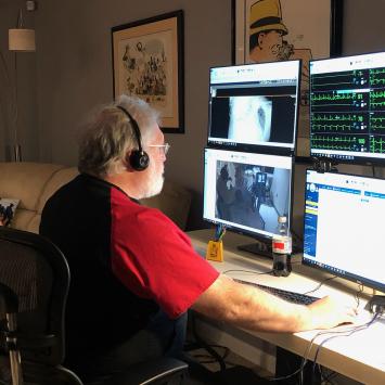 Dr. Steven Brown '77 at his home computer station