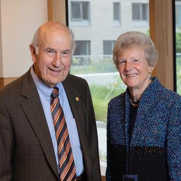 Gilbert Omenn and Martha Darling smiling 