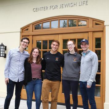 Students pose in front of the Center for Jewish Life