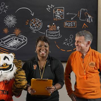 Orange & Black Day huddle