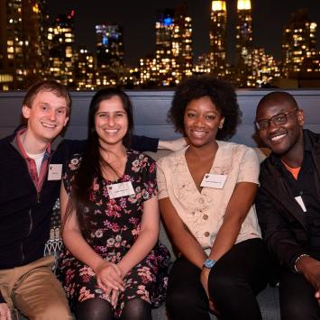 Alumni seated together at the Recent Alumni gathering in New York City