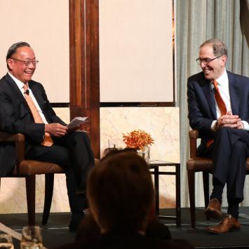 President Eisgruber and Harold Kim conversing on stage in Hong Kong