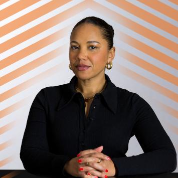 Autumn Woman, dressed in black, posing for camera