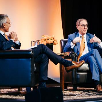 Philip Hammarskjold ’87 and President Christopher L. Eisgruber ’83 on stage together in West Palm Beach, Florida.