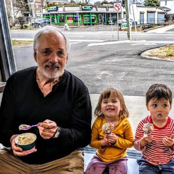 Doug Grover '74 and two grandchildren eat ice cream together