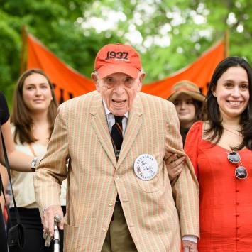Joe Schein and his granddaughters walk in the 2018 P-rade